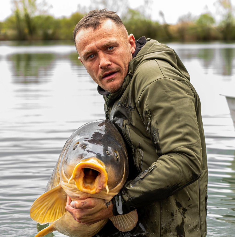 c4rpycraig holding a big mirror carp